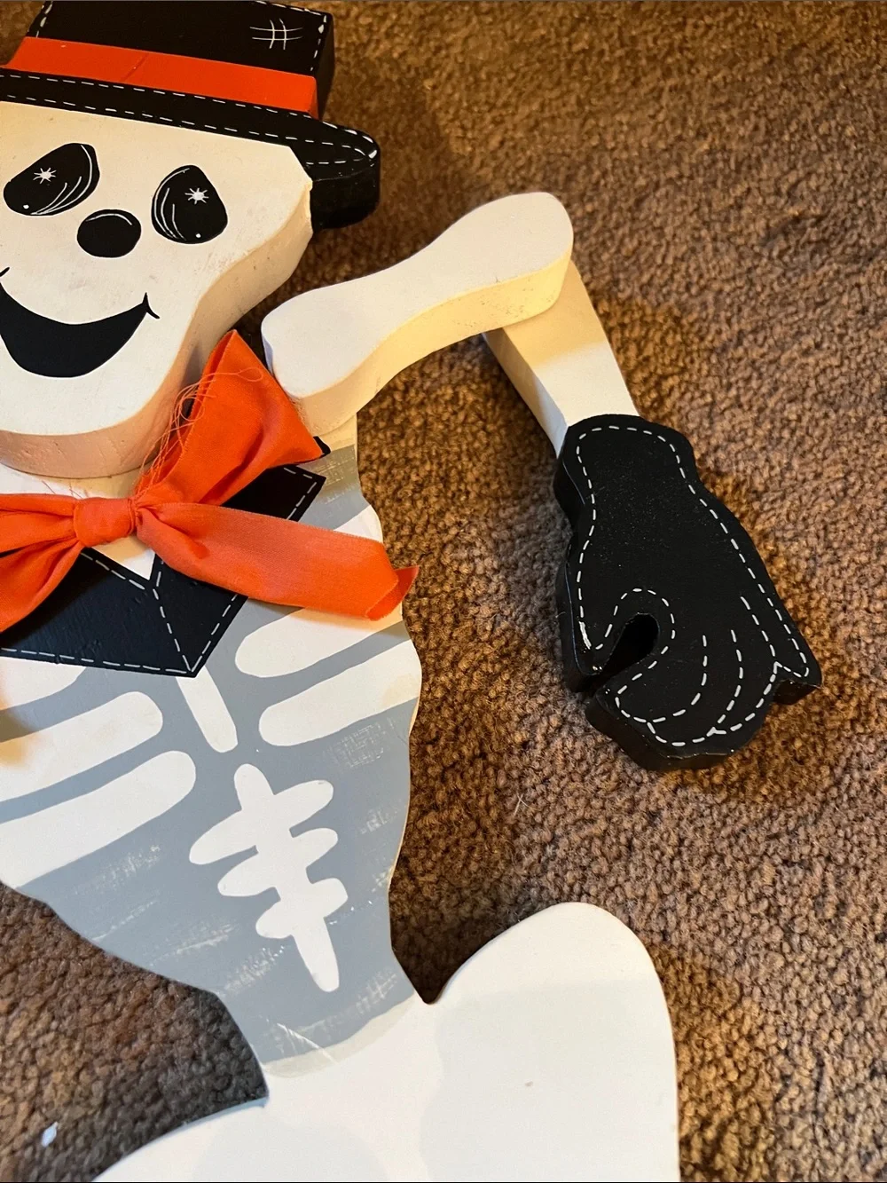 Skeleton Wood Decor with Orange Accents